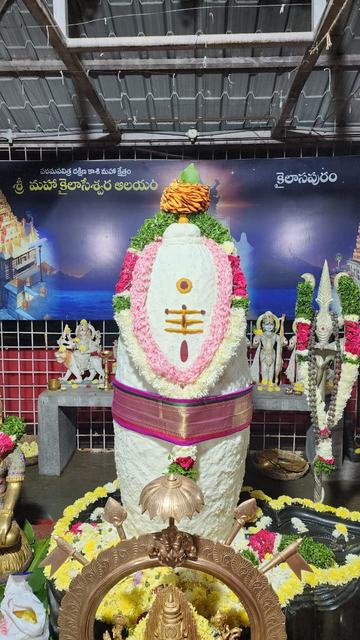 Shivalingam decorated with flower garlands